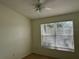 Well-lit bedroom with a large window and ceiling fan at 6405 Osprey Lake Cir, Riverview, FL 33578
