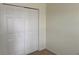 Bedroom showcasing a closet with white doors and classic panel design at 6405 Osprey Lake Cir, Riverview, FL 33578