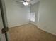 Neutral bedroom features a ceiling fan and natural light from a window at 6405 Osprey Lake Cir, Riverview, FL 33578