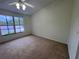 Bedroom with a large window that lets in plenty of natural light at 6405 Osprey Lake Cir, Riverview, FL 33578