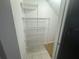 Walk-in closet with white wire shelving for storage in a well-lit area at 6405 Osprey Lake Cir, Riverview, FL 33578
