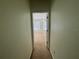 Hallway leading to a bedroom, showing the layout and flow of the home at 6405 Osprey Lake Cir, Riverview, FL 33578