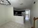 View of the kitchen with a breakfast bar, white appliances, and tile flooring at 6405 Osprey Lake Cir, Riverview, FL 33578