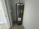 A utility closet containing a Rheem hot water heater at 6405 Osprey Lake Cir, Riverview, FL 33578