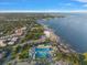 Expansive aerial view of community pool, waterfront and stunning coastline on a clear day at 700 Beach Ne Dr # 705, St Petersburg, FL 33701