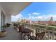 Charming balcony with wrought-iron furniture, offering views of the city skyline and the tranquil ocean at 700 Beach Ne Dr # 705, St Petersburg, FL 33701