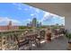 Inviting balcony with cozy seating, perfect for enjoying panoramic city views and the blue sky at 700 Beach Ne Dr # 705, St Petersburg, FL 33701