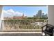 Balcony view showing a large pink hotel with a blue sky and some white clouds at 700 Beach Ne Dr # 705, St Petersburg, FL 33701