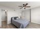 Neutrally decorated bedroom with hardwood floors, a walk-in closet, ceiling fan and plenty of natural light at 700 Beach Ne Dr # 705, St Petersburg, FL 33701