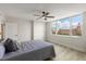 Bedroom featuring hardwood floors, a ceiling fan, neutral paint and an exterior view at 700 Beach Ne Dr # 705, St Petersburg, FL 33701