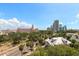 An exterior view of a charming cityscape with buildings, palm trees and a view of the sky at 700 Beach Ne Dr # 705, St Petersburg, FL 33701