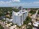 Exterior building view with balconies overlooking landscaped grounds in a residential neighborhood at 700 Beach Ne Dr # 705, St Petersburg, FL 33701