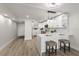Bright kitchen features white cabinetry, marble countertops, a breakfast bar, and stainless steel appliances at 700 Beach Ne Dr # 705, St Petersburg, FL 33701