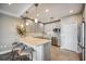 Modern kitchen featuring granite countertops, stainless steel appliances, and a stylish breakfast bar with seating at 700 Beach Ne Dr # 705, St Petersburg, FL 33701