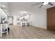 Spacious living room that features wood floors, a breakfast bar and a modern decorative wall at 700 Beach Ne Dr # 705, St Petersburg, FL 33701
