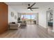 Bright living room boasts hardwood floors, modern furnishings, and views of the historic Don CeSar hotel at 700 Beach Ne Dr # 705, St Petersburg, FL 33701