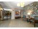 Lobby featuring a stone accent wall, stylish lighting, and a comfortable seating area with plants at 700 Beach Ne Dr # 705, St Petersburg, FL 33701