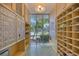 Indoor view of the mail room with mailboxes, shelves, window, and terrazzo flooring at 700 Beach Ne Dr # 705, St Petersburg, FL 33701