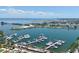 Aerial view of marina with many boats docked on the water with city views in the background at 700 Beach Ne Dr # 705, St Petersburg, FL 33701