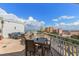 Relaxing rooftop terrace with tables and chairs, perfect for enjoying the scenic cityscape and beautiful weather at 700 Beach Ne Dr # 705, St Petersburg, FL 33701