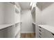 Walk-in closet featuring hardwood floors, built in shelving, and a built-in drawer set at 700 Beach Ne Dr # 705, St Petersburg, FL 33701