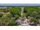 This aerial showcases a home with proximity to a nature area, blending residential and natural elements at 705 Cypress St, Tarpon Springs, FL 34689