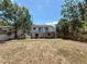 A full shot of the home and the exterior decks that lead into the dry and spacious backyard at 705 Cypress St, Tarpon Springs, FL 34689