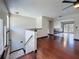 Bright living room featuring rich hardwood floors, a ceiling fan, and an open floor plan at 705 Cypress St, Tarpon Springs, FL 34689