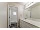 Bright bathroom featuring white cabinets, quartz counters, subway tile, tub, and modern fixtures at 7517 Oxwood St, North Port, FL 34287
