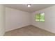 Bedroom with neutral carpet, window with natural light, and ample space at 7517 Oxwood St, North Port, FL 34287