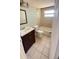 Cozy bathroom featuring neutral tile and a shower-tub combination, providing a comfortable and functional space at 7734 Judith Cres, Port Richey, FL 34668