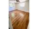 Bright bedroom with wood-look flooring and natural light, creating a serene and comfortable atmosphere at 7734 Judith Cres, Port Richey, FL 34668
