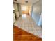 Open-concept living space featuring tile and laminate flooring, seamlessly connecting living, dining, and kitchen areas at 7734 Judith Cres, Port Richey, FL 34668