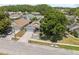 Aerial view of a lovely single-Gathering home in a serene neighborhood with mature trees at 7903 Lake Placid Ln, Trinity, FL 34655
