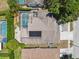 An aerial view showing the house roof, pool, and fence at 7903 Lake Placid Ln, Trinity, FL 34655