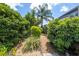 Beautiful landscaping design and gravel pathway in the backyard at 7903 Lake Placid Ln, Trinity, FL 34655