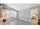 Bright and airy empty room with tile flooring and large window, perfect for customization at 7903 Lake Placid Ln, Trinity, FL 34655