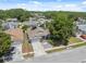 Home featuring a two-car garage and beautiful rock garden at 7903 Lake Placid Ln, Trinity, FL 34655
