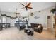 Comfortable living room with stylish furniture open to kitchen and dining area at 7903 Lake Placid Ln, Trinity, FL 34655