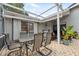 Covered outdoor patio with seating area. Perfect for outdoor entertainment at 7903 Lake Placid Ln, Trinity, FL 34655