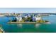 Beautiful aerial showcasing a luxury waterfront community with pristine landscaping at 8000 Sailboat Key S Blvd # 202, St Pete Beach, FL 33707