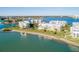 Stunning aerial view of waterfront condos with manicured lawns and beautiful bay views at 8000 Sailboat Key S Blvd # 202, St Pete Beach, FL 33707