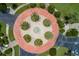 Aerial view of roundabout with palm trees, lush green landscaping and water feature at 8000 Sailboat Key S Blvd # 202, St Pete Beach, FL 33707