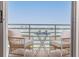 Balcony featuring comfortable seating, providing a relaxing space with a view of the water at 8000 Sailboat Key S Blvd # 202, St Pete Beach, FL 33707