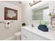 Beautiful bathroom with modern fixtures, framed mirror and stylish decor at 8000 Sailboat Key S Blvd # 202, St Pete Beach, FL 33707