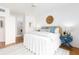 Comfortable bedroom with a ceiling fan, water view, decorative accents, and calming natural light at 8000 Sailboat Key S Blvd # 202, St Pete Beach, FL 33707