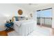 Bright bedroom with large windows, light colored walls and furniture creating a serene atmosphere at 8000 Sailboat Key S Blvd # 202, St Pete Beach, FL 33707