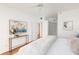 Bright bedroom with fresh decor and an en-suite bathroom, creating a comfortable and stylish space at 8000 Sailboat Key S Blvd # 202, St Pete Beach, FL 33707