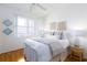 This cozy bedroom features a comfortable bed, ample natural light, and stylish decor at 8000 Sailboat Key S Blvd # 202, St Pete Beach, FL 33707