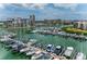 Scenic view of marina with numerous boats docked, set against a backdrop of condos at 8000 Sailboat Key S Blvd # 202, St Pete Beach, FL 33707